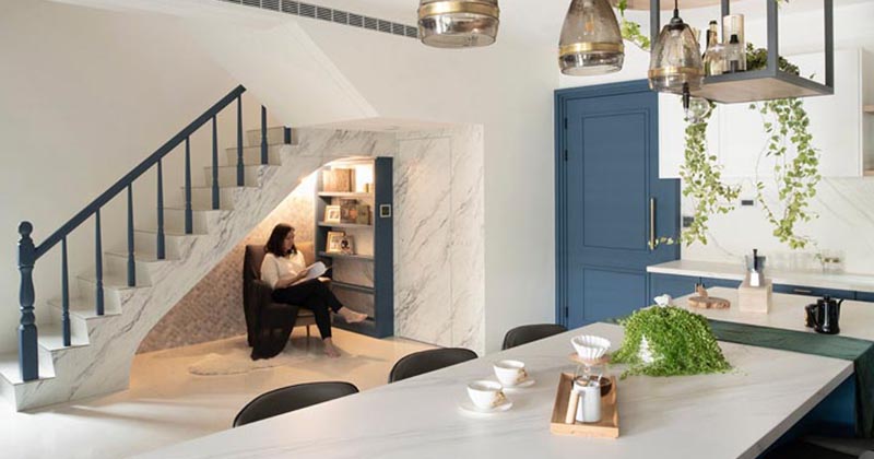 A Small Reading Nook Under The Stairs Makes Use Of An Otherwise Awkward Space