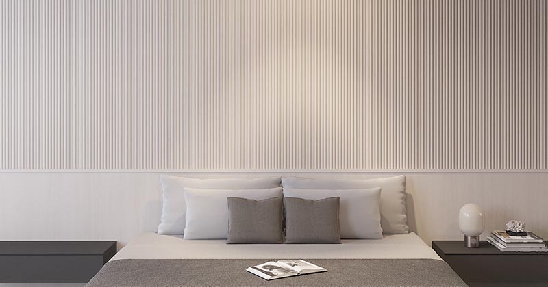 A Wall Of Wood Dowels Creates A Calm Texture For This Bedroom