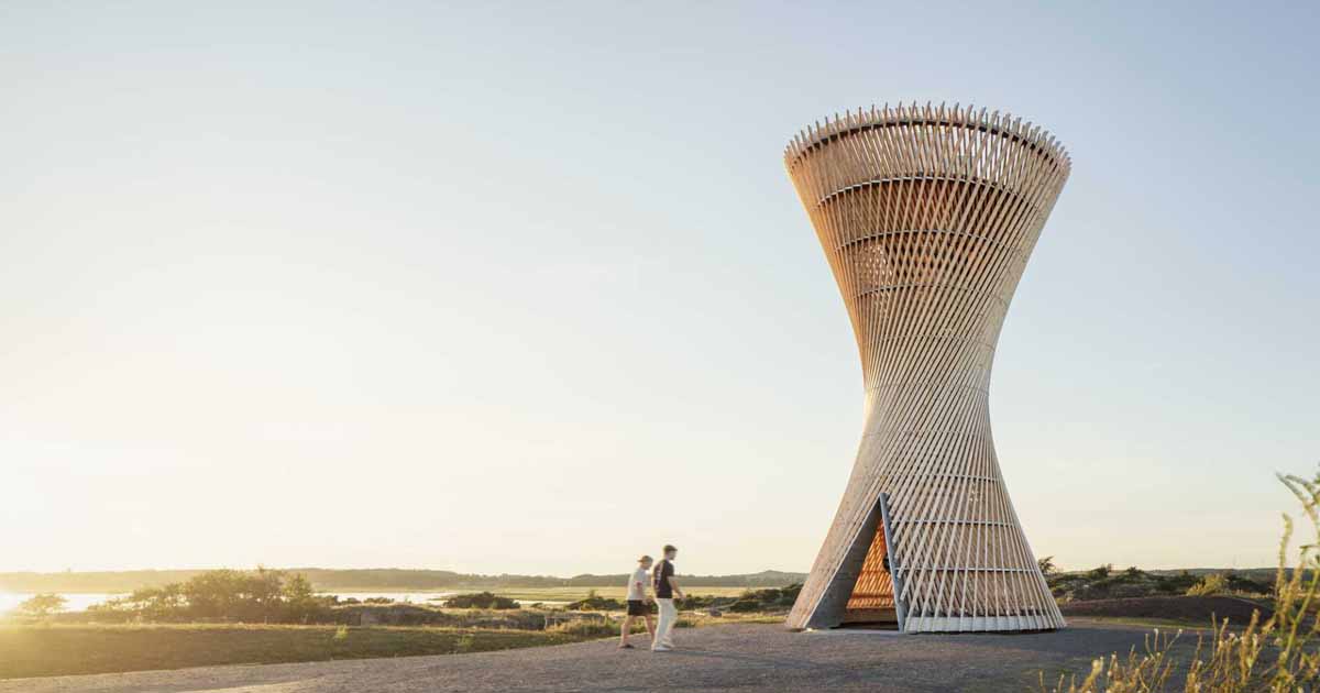 An Observation Tower That Looks Like Twisted Wood Rises Above The Swedish Landscape