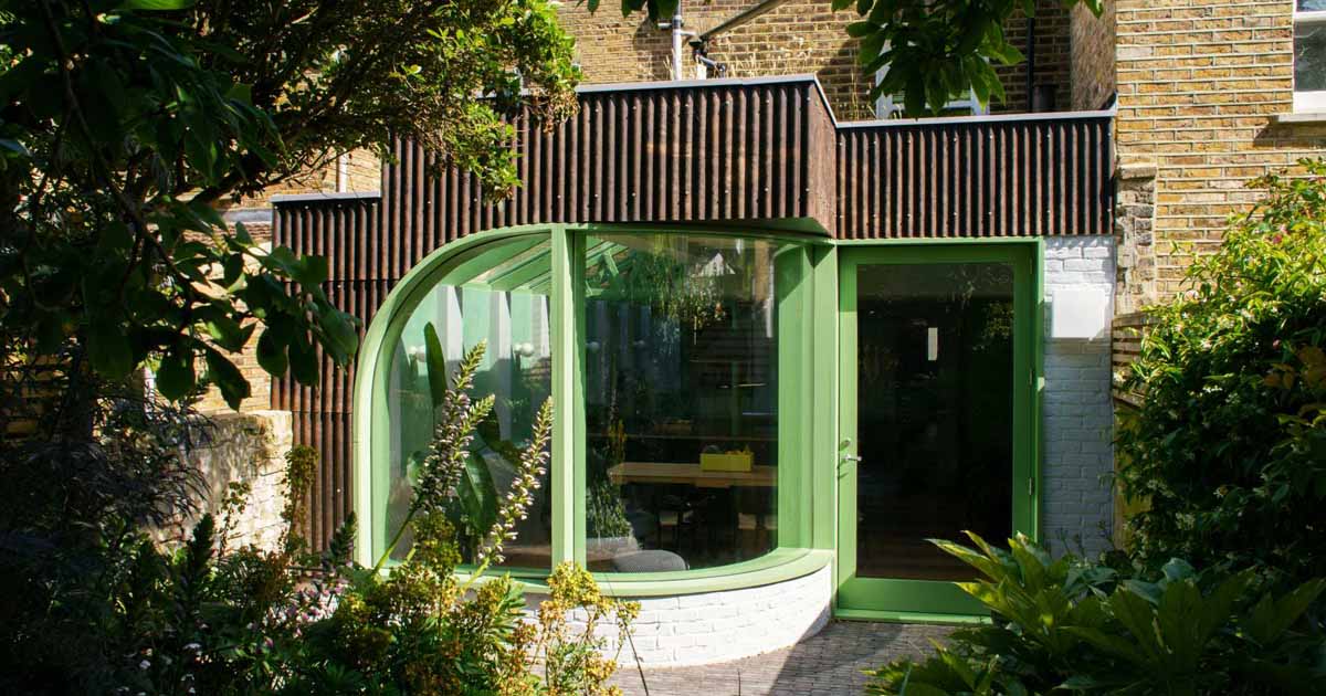 A House Extension With A Curved Window Makes Room For A New Kitchen At This Home In London