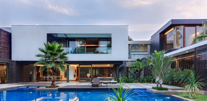 This Home Was Designed To Wrap Around The Swimming Pool