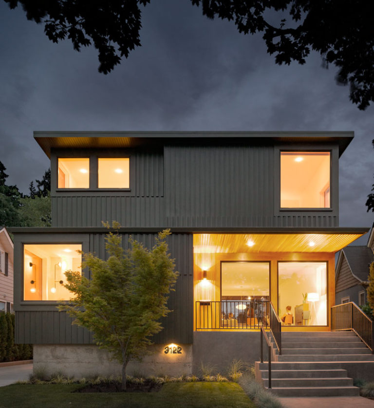 A dark board and batten clad home arrives on this street in Portland