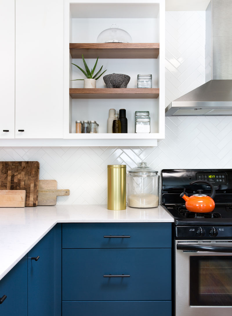 This Home Received An Updated Kitchen With Blue Cabinets And White ...