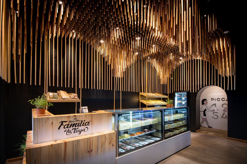 Modern Retail Store Design With Sculptural Wood Ceiling