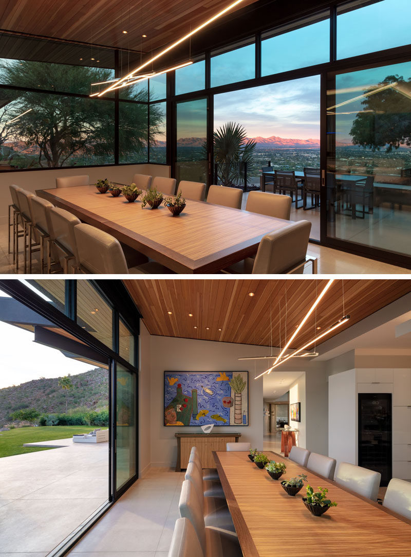 Plenty of windows and glass doors provides this dining room with sweeping views and natural light. #DiningRoom