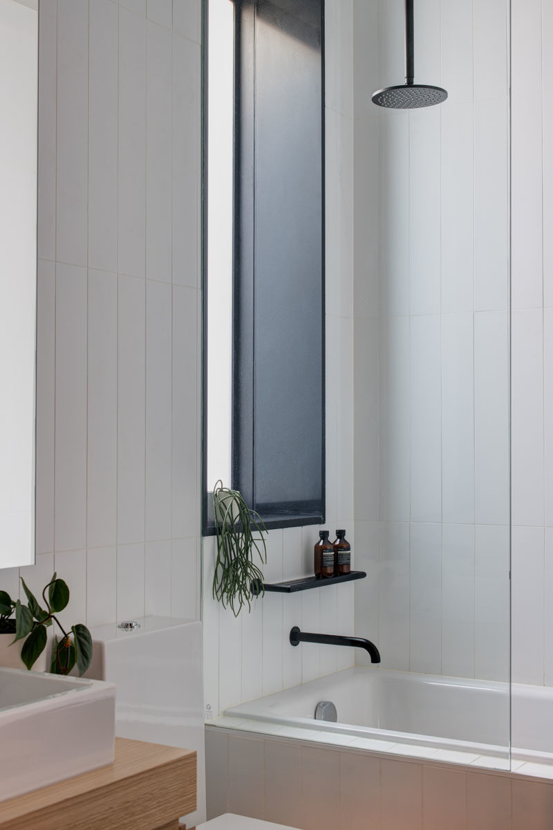 Bathroom Ideas - This modern bathroom features a rainfall shower head and a built-in bath. #Bathroomideas #ModernBathroom
