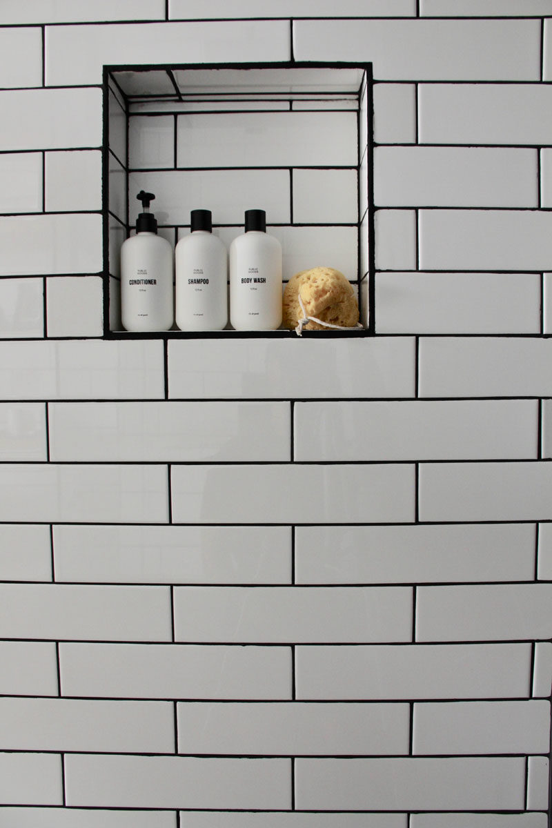 Bathroom Ideas - A built-in shelf in the shower provides a place for storing soap, shampoo, and conditioner. #BathroomIdeas #ShowerShelf #BuiltInShelf #BathroomDesign