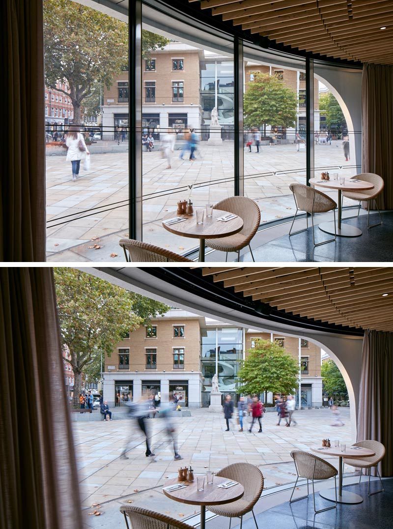 Sweeping curves of the large plate glass windows can be opened to connect the ground floor interior of the restaurant with the square. #Windows #RestaurantWindows #CurvedWindows