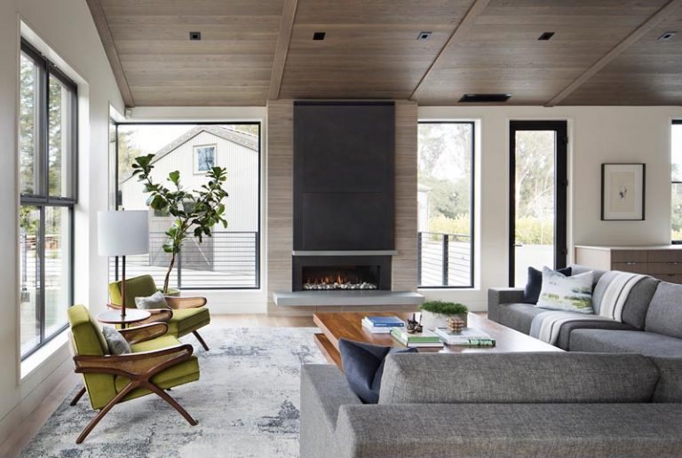 A Linear Fireplace With A Steel Surround And Cantilevered Hearth Is The ...