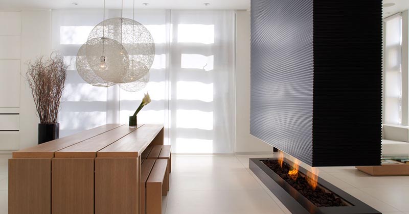 This Room Divider Is A Suspended Wall That Also Includes A Fireplace And TV