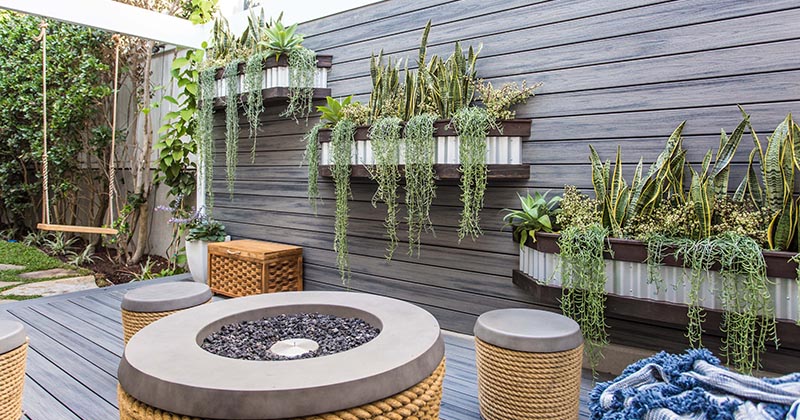 Overflowing Wall Planters Are An Effective Way To Add Interest To An Otherwise Blank Wall