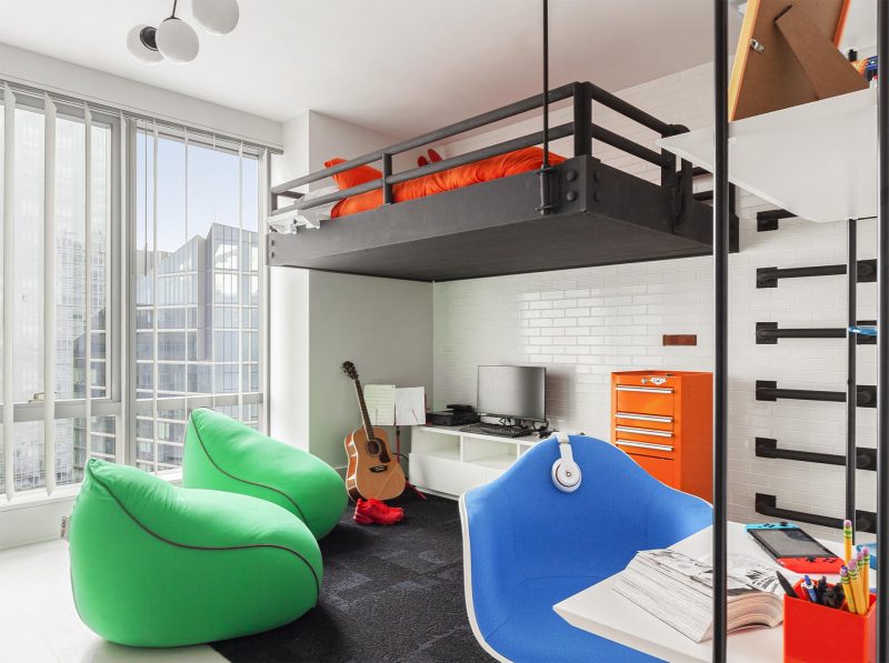 A loft bed creates open floor space for this teen's bedroom.