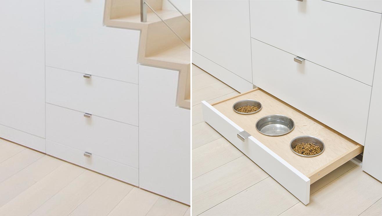 Under stair storage includes a pull-out pet food bowl drawer.