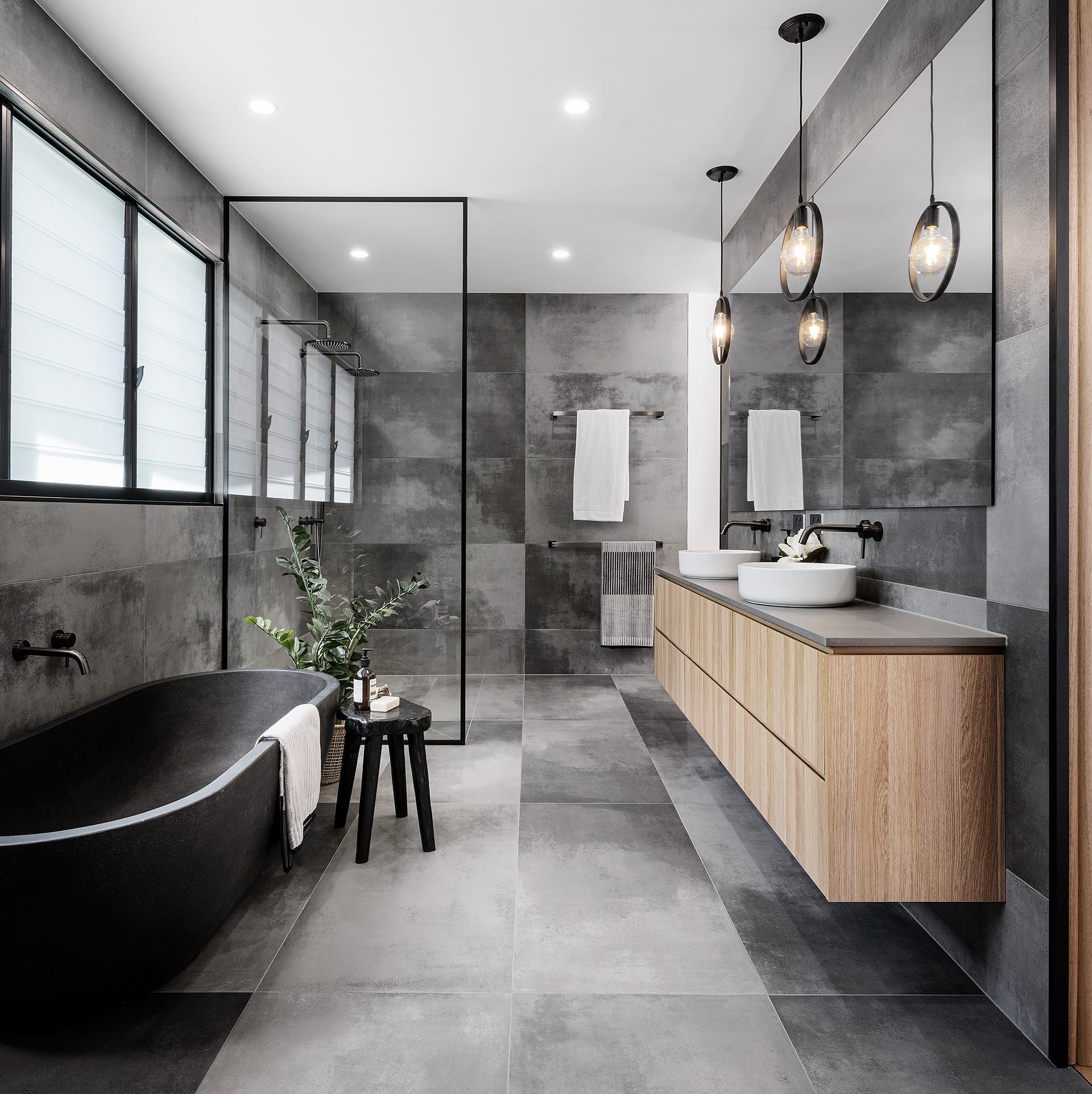 A Cloudy Grey Tile Sets The Palette For This Bathroom