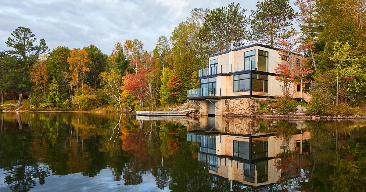 The 'Val-des-Monts Boathouse' Sits Prominently On The Shores Of A Canadian Lake