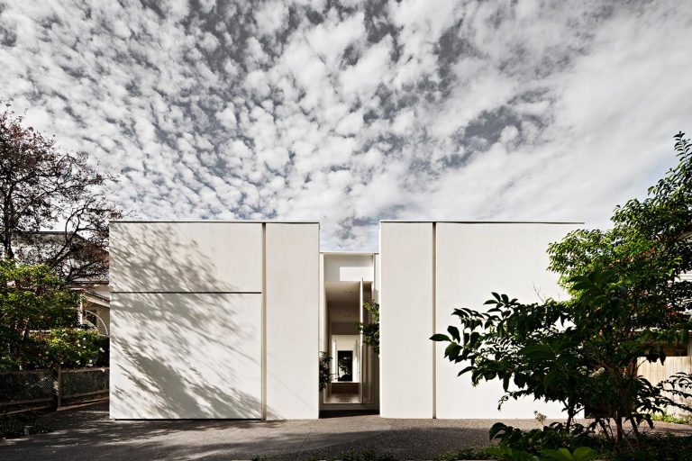 The Minimalist White Exterior Of This Modern House Opens To A Matching ...