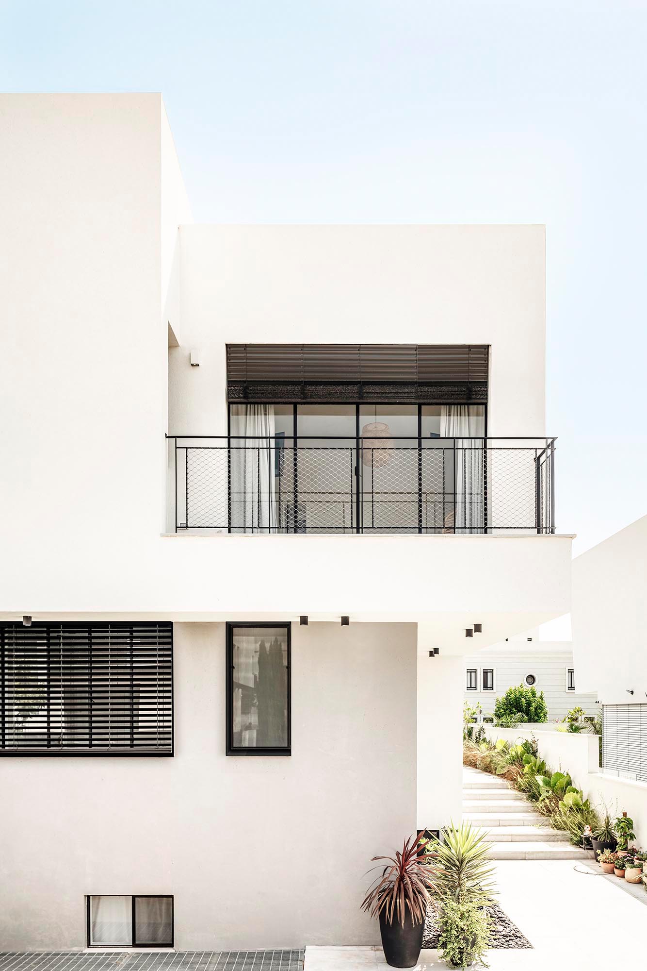 A White Interior With Matte Black Accents Matches This Home's Exterior