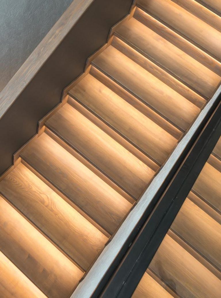 A Strip Of LED Lights Under The Stairs Of This Home Adds A Warm Glow To   Modern Stairs With Hidden Lighting 281020 913 04 768x1033 