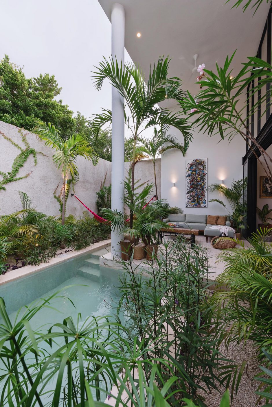 The Simple Exterior Of This Home Hides The Tropical Paradise Within It