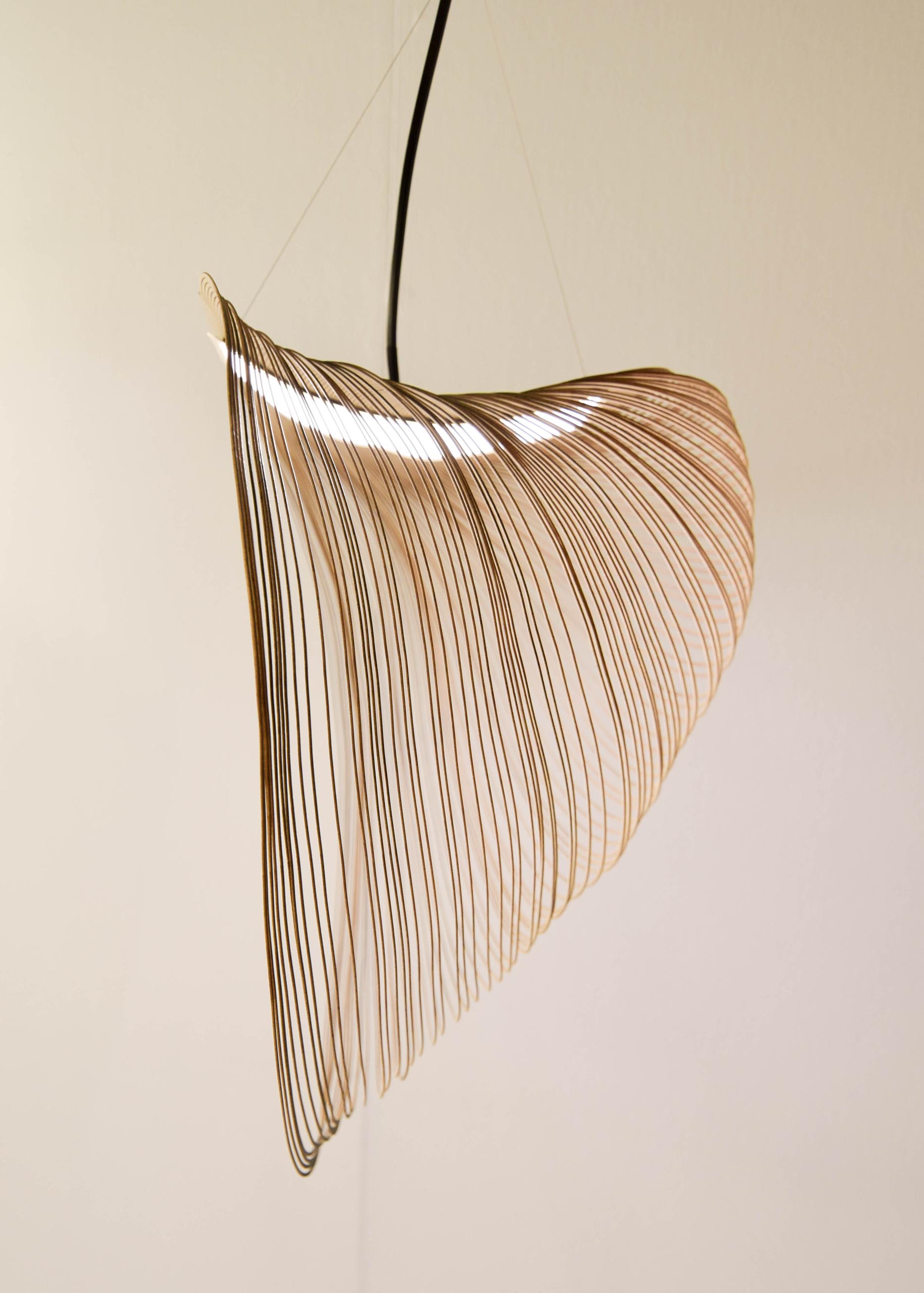 The Angles pendant lamp is perfect harmony of laser-cut wooden rectangles