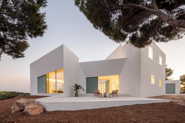 The Modern White Minimalist Exterior Of This Home Is Softened By The ...