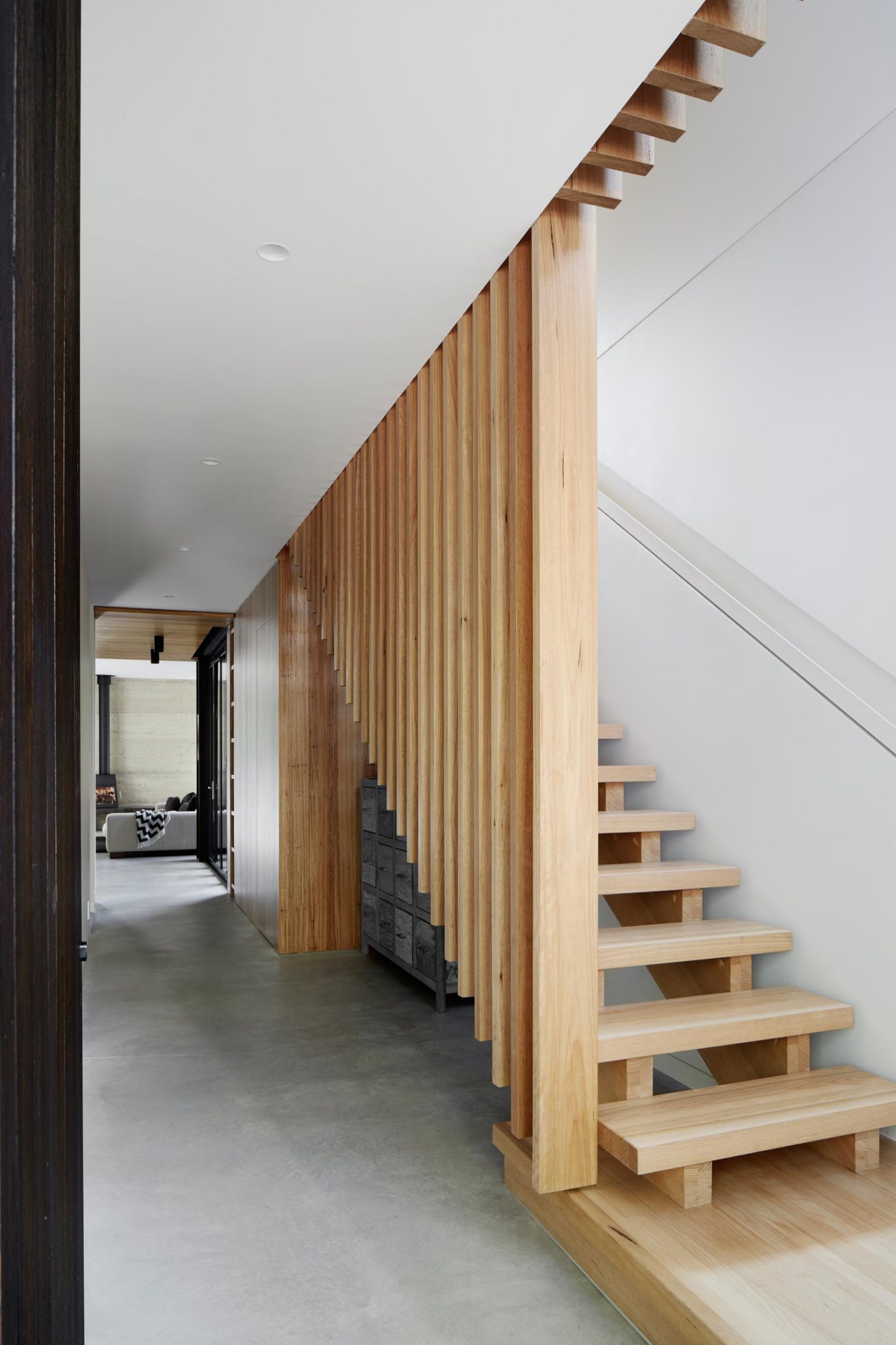 An Exterior Of Blackbutt Timber Hides The Bright White Interior Of This 