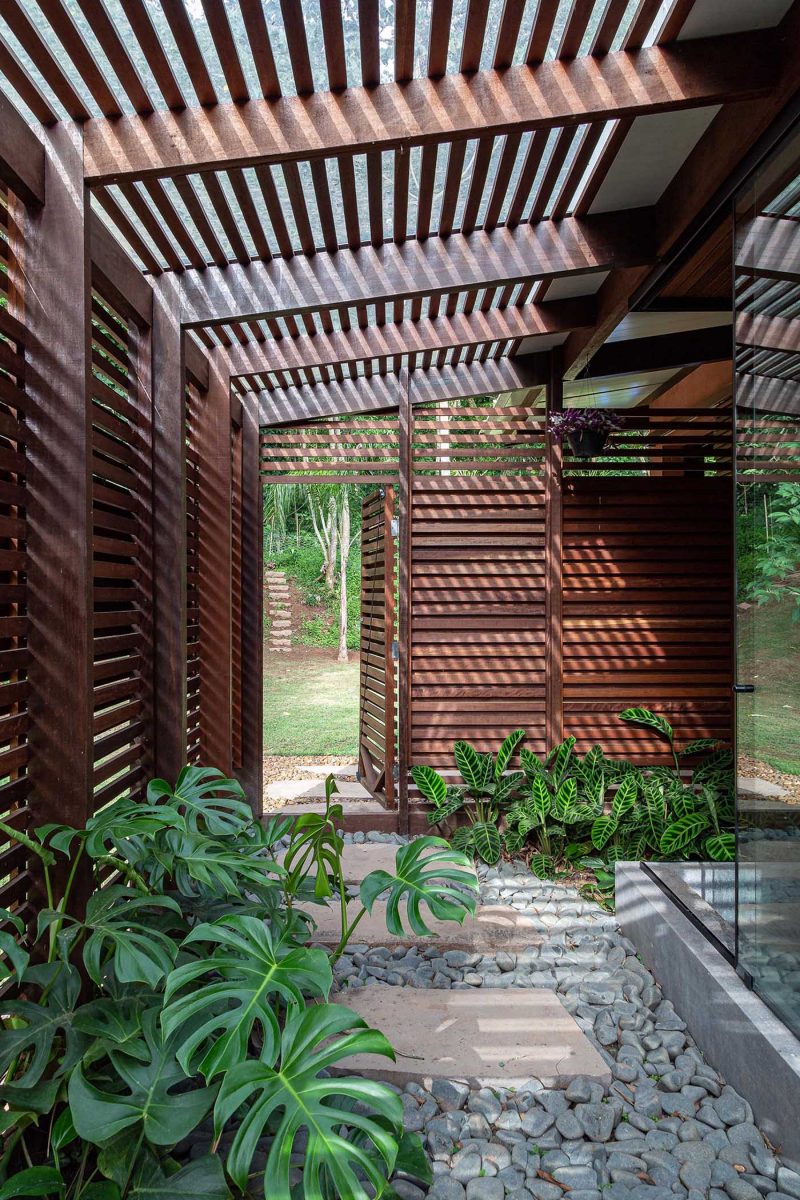 A Built-In Bench Wraps Around The Large Corner Window Of A This Home