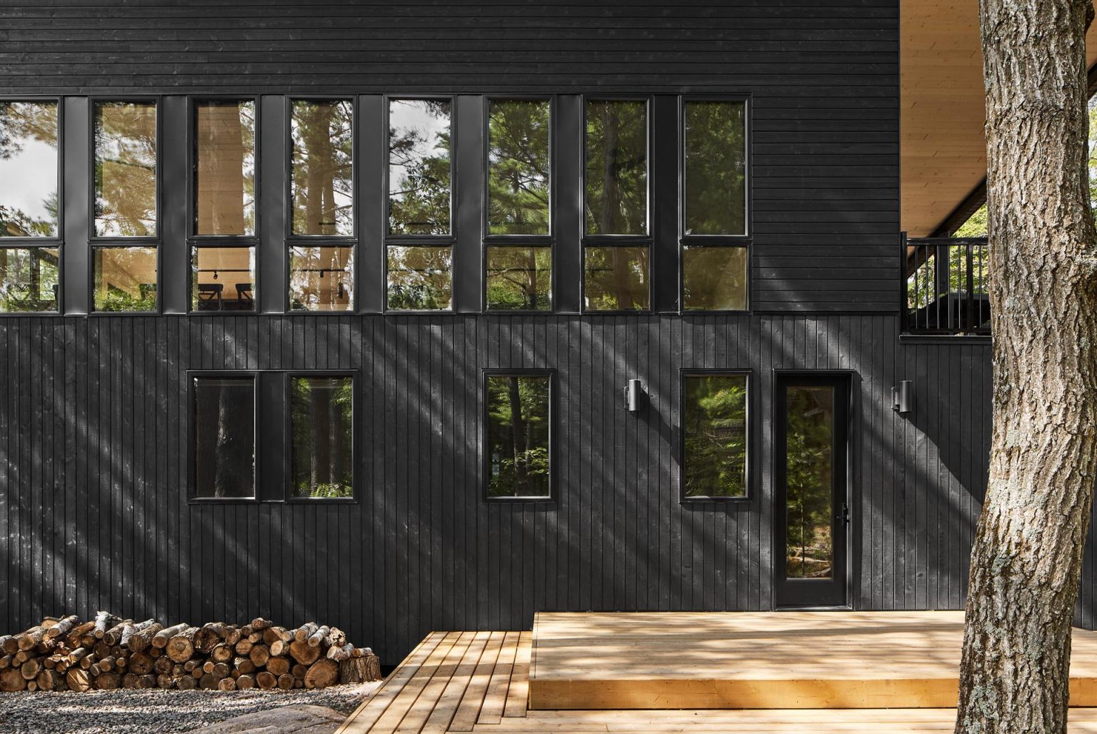 Black Windows Frames Blend Into The Black Wood Siding On The Exterior ...