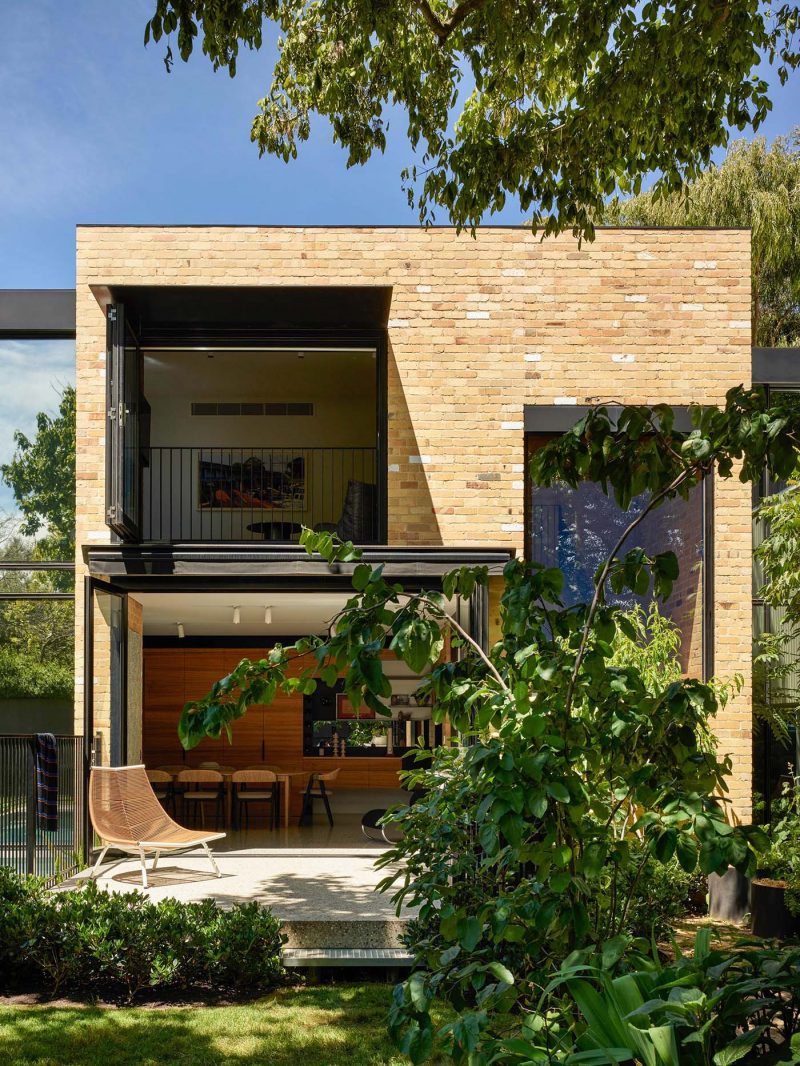 white brick house with metal roof