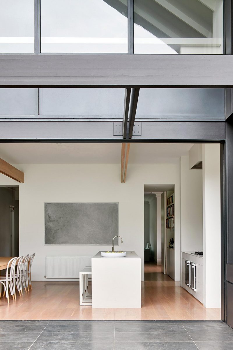 Black Metal Siding Covers The Peaked Roof Addition On This Home Remodel