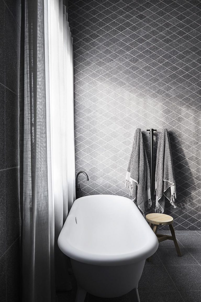 Grey Terrazzo Tiles Help Create A Moody Feeling In These Bathrooms