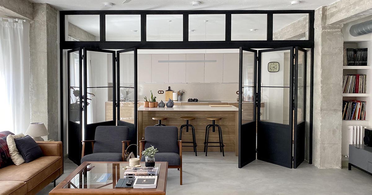 Black-Framed Doors With Windows Enclose The Kitchen But Not The Natural Light