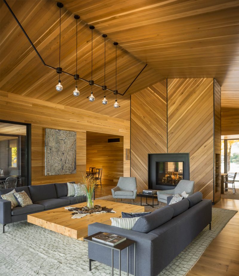 The Black Exterior Of This Home Leads To A Warm Wood Lined Interior