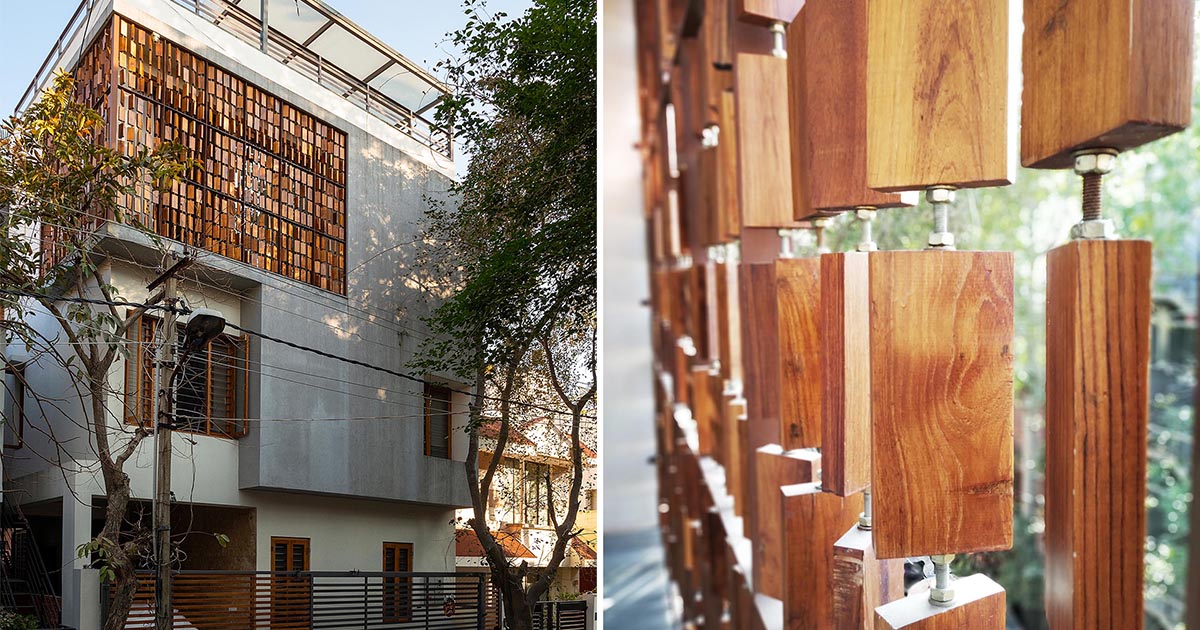 A Screen Made From Wood Blocks Wraps Around The Corner Of This Home