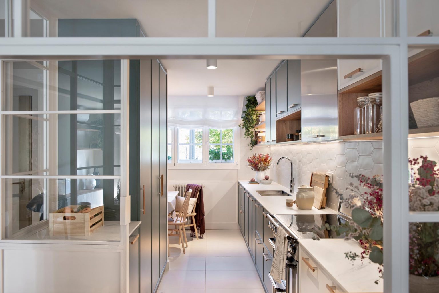 A Glass Enclosed Kitchen Is A Noticeable Design Feature Of This Home Remodel