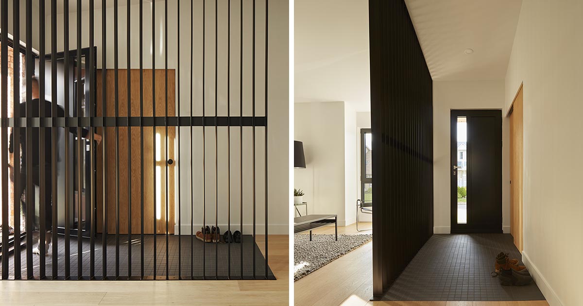 A Black Partition Helps Create A Designated Entryway For This House Remodel