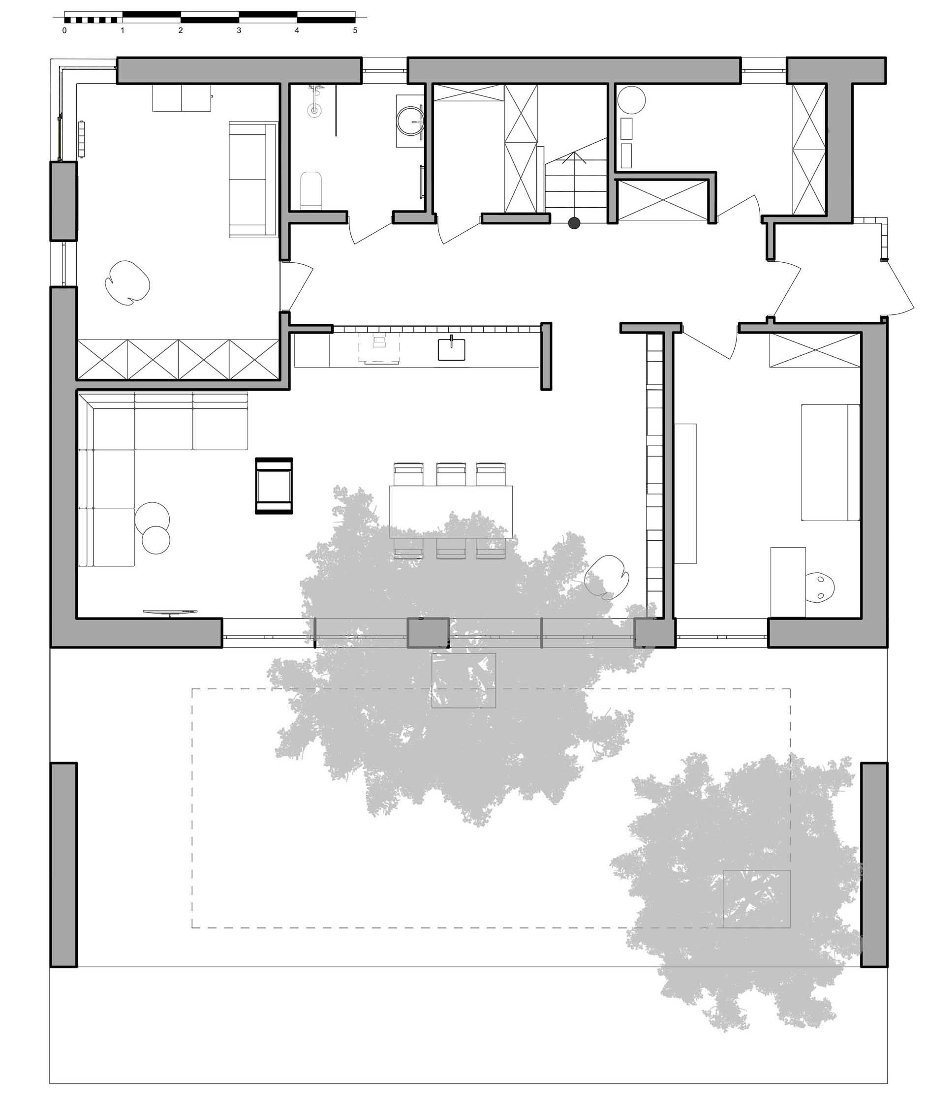 The floor plan of a modern house with a sloped green roof.
