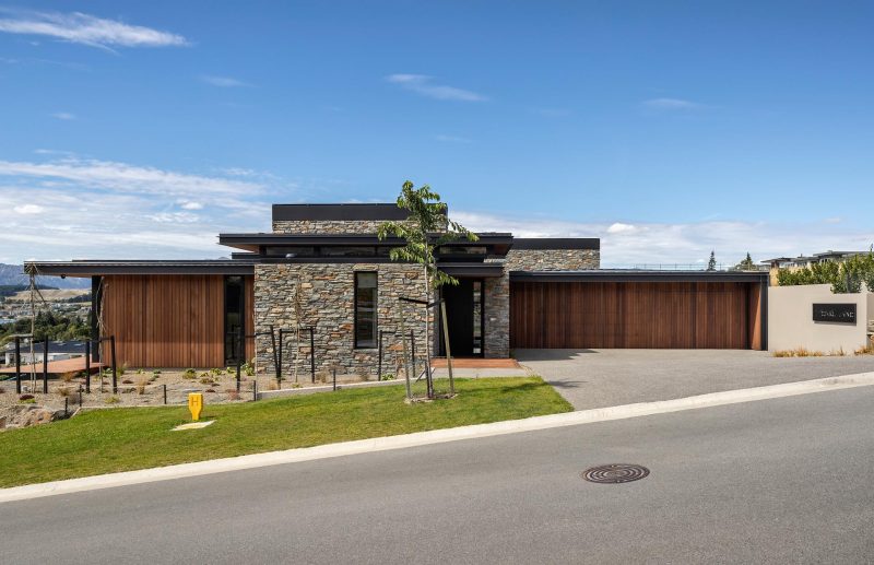 The Combination Of Stone And Wood Gives This Home A Rustic Modern Look