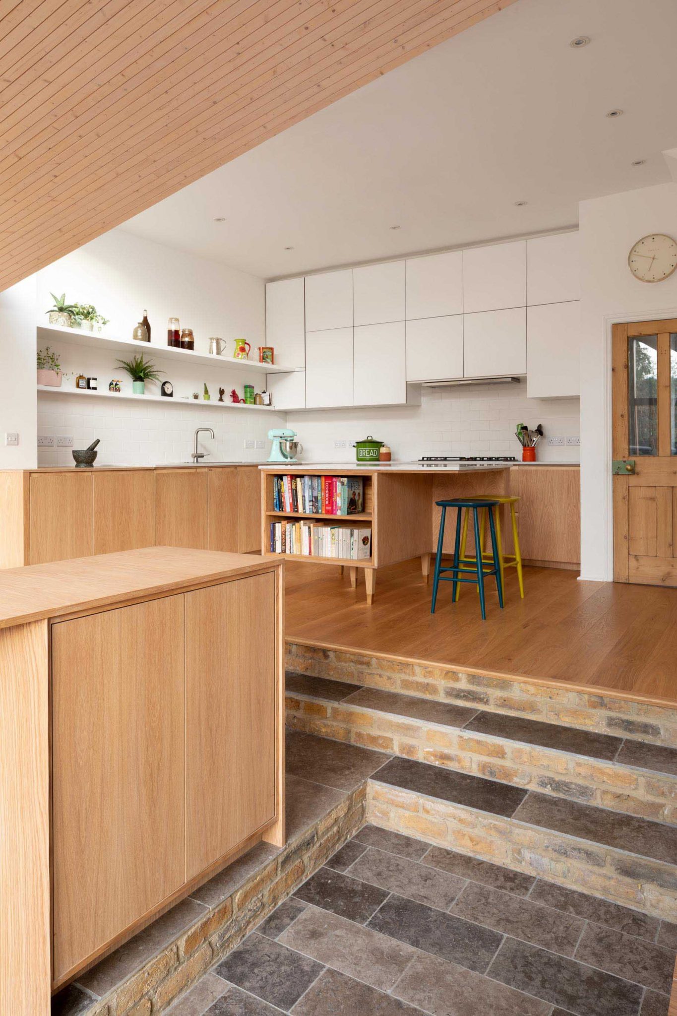 A Wood Lined Angled Ceiling Adds Architectural Interest In This Home ...