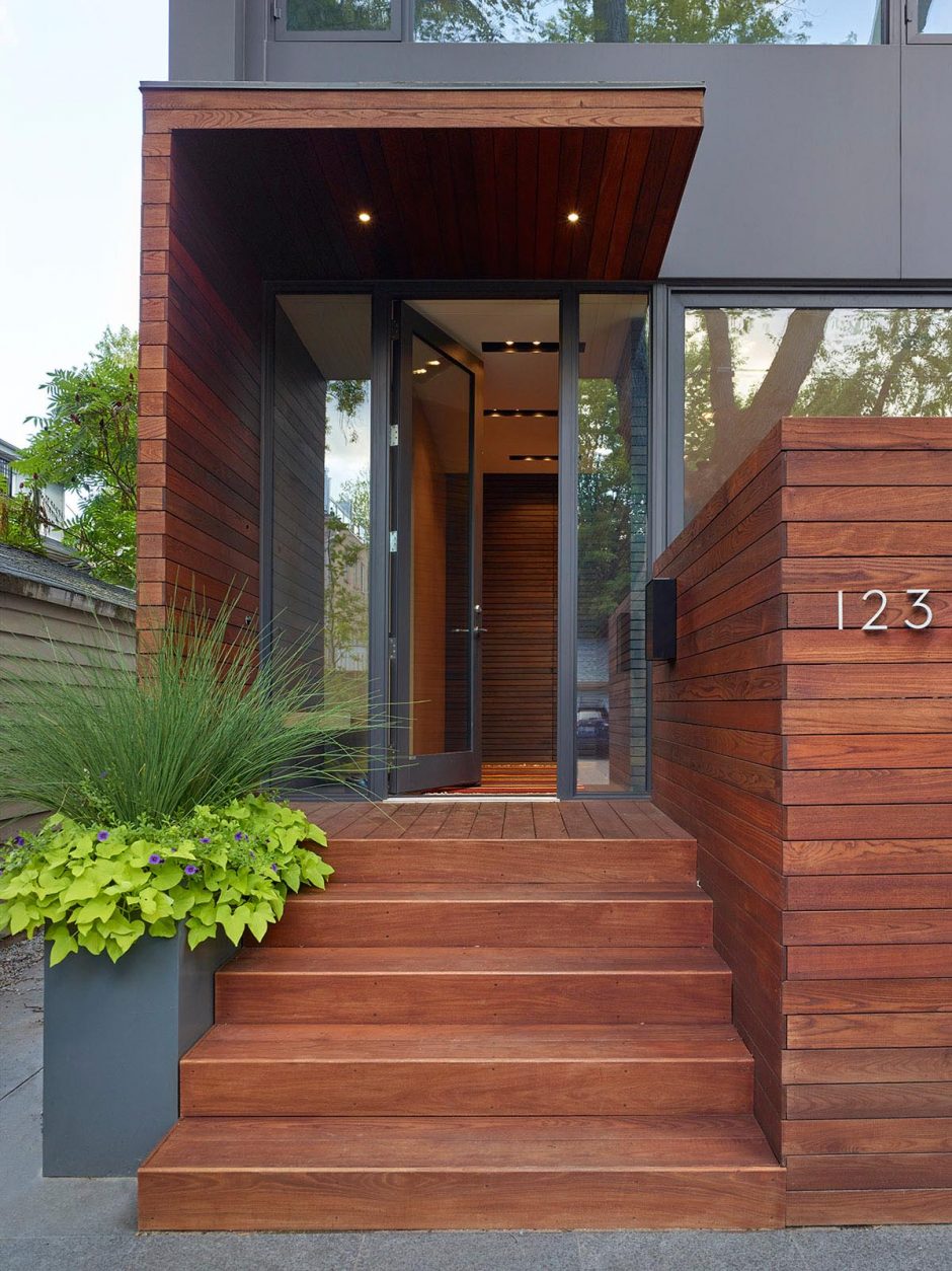 Large Windows Overlook A Garage With A Green Roof At This Home In Toronto