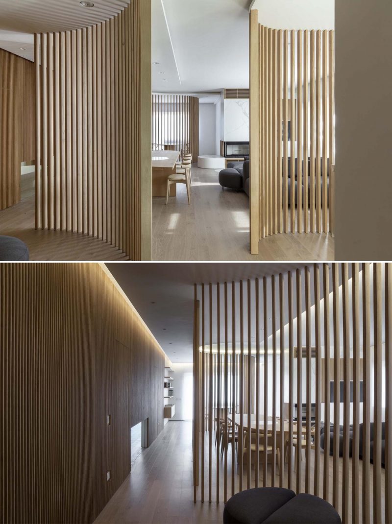 Oak Slat Walls Divide The Spaces Inside This Apartment's Interior