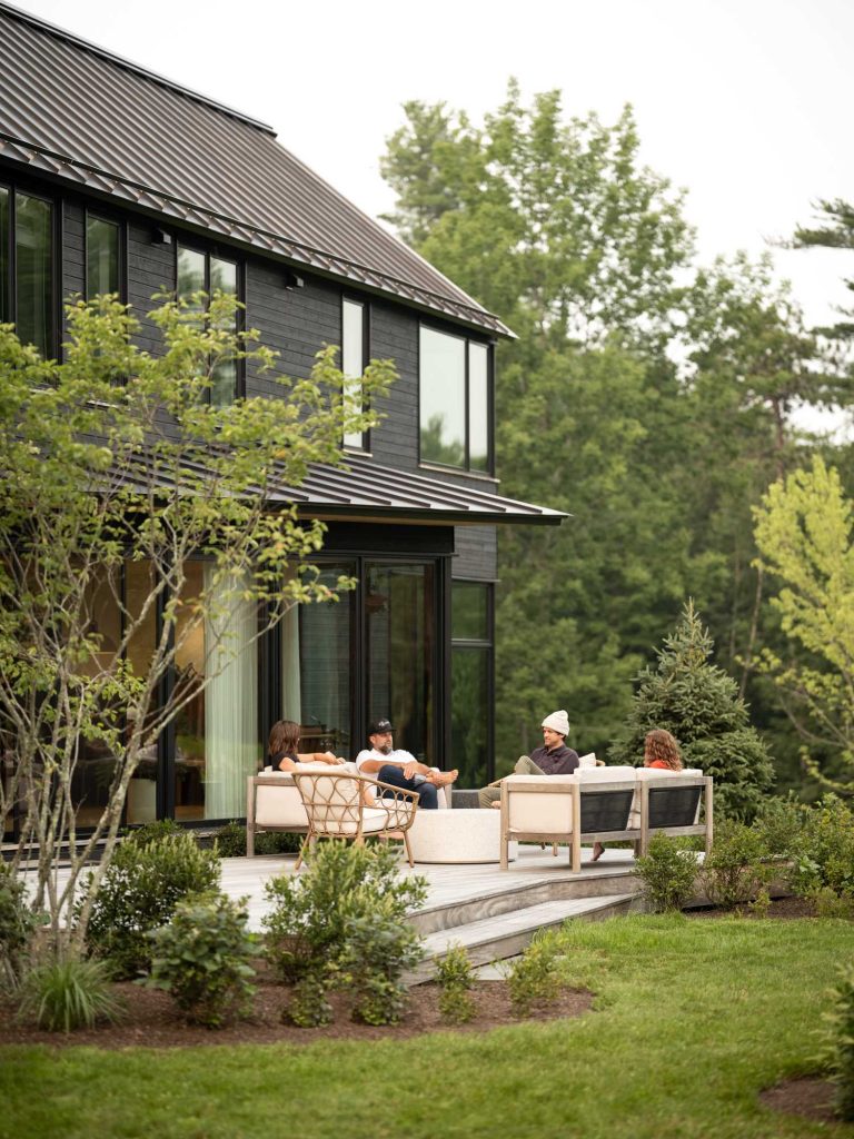 Black Stained Wood Siding Covers The Exterior Of This New Home In Maine