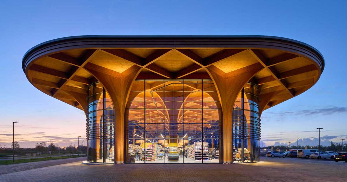 Elegant Cathedral-Like Wood Columns Support A Canopy Over This New Supermarket