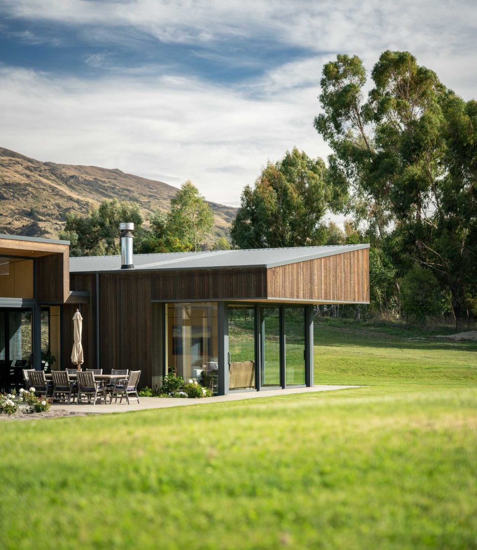 Sloping Rooflines Overhang The Separate Wings Of This Home