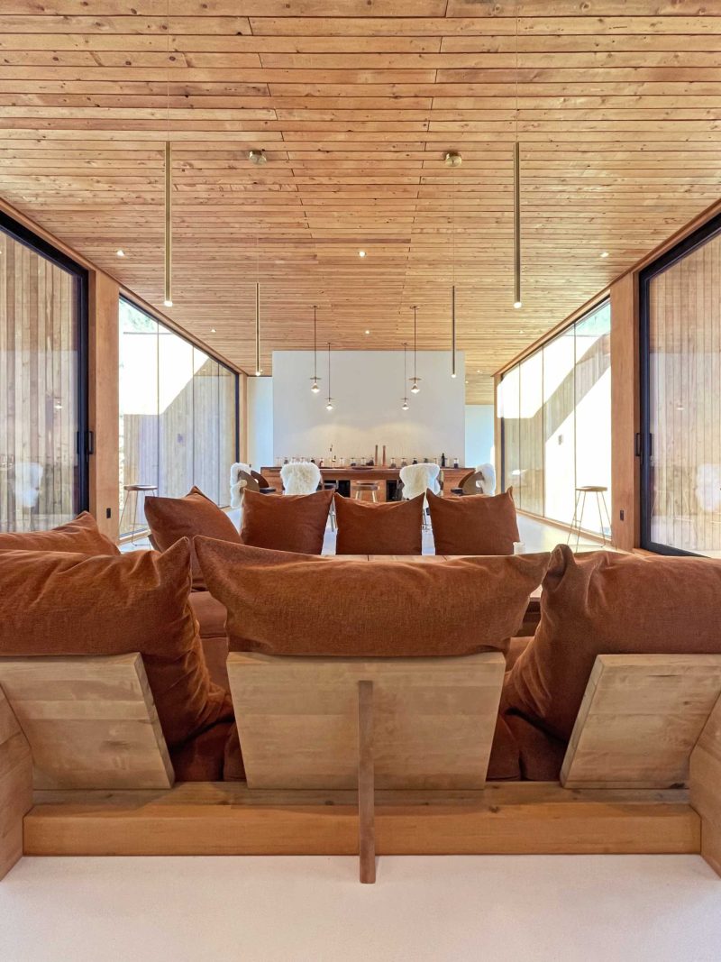 Wood And Glass Frame The Tree Views At This Home In The Mountains