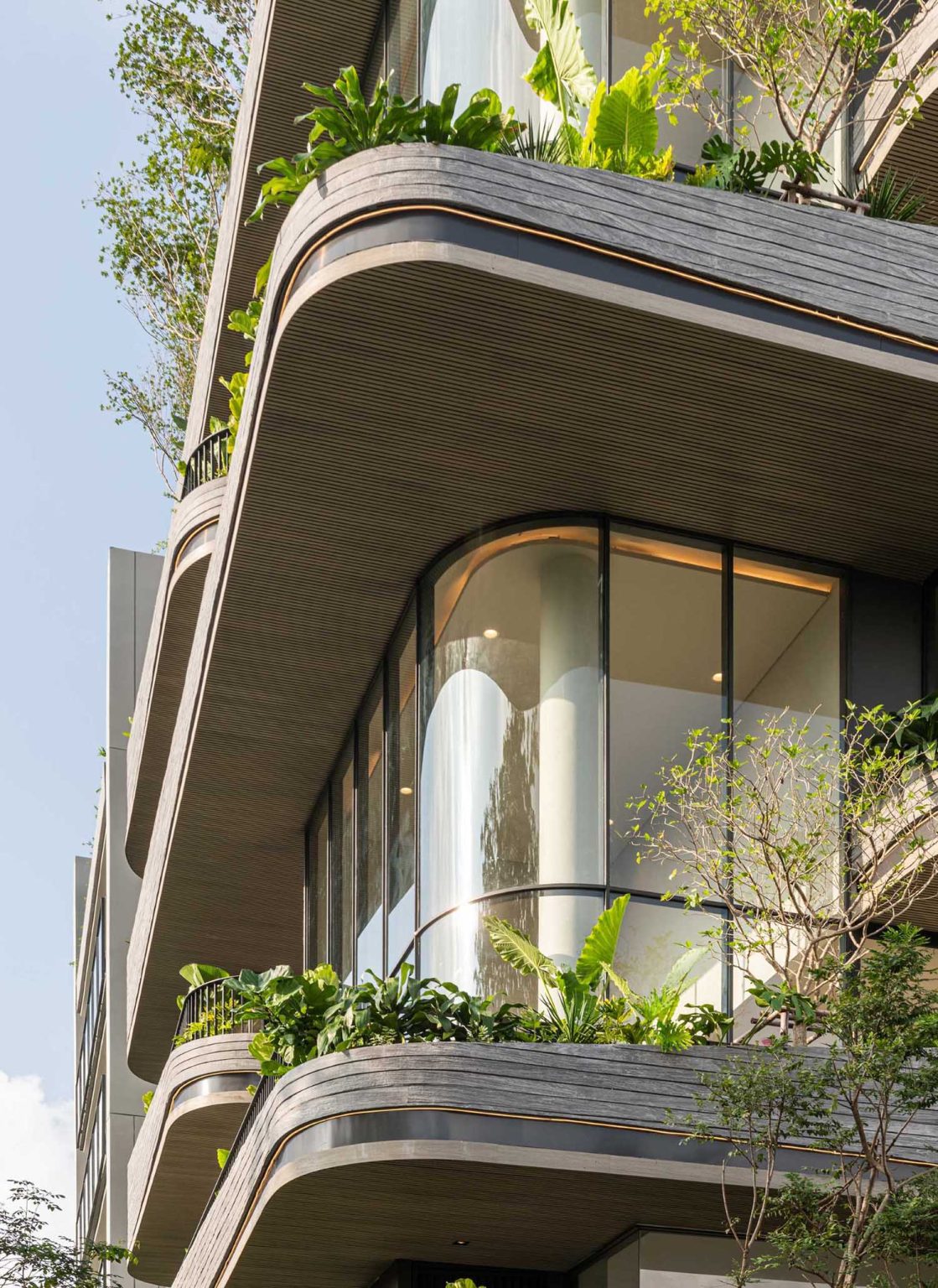 Lighting Is Used To Highlight The Rounded Balconies Of This Building