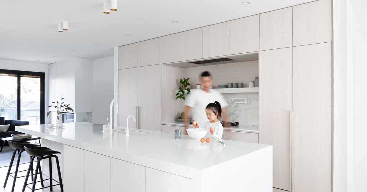 White Stained Oak Cabinets Paired With Cool White Marble Creates A Soft Aesthetic Inside This Home