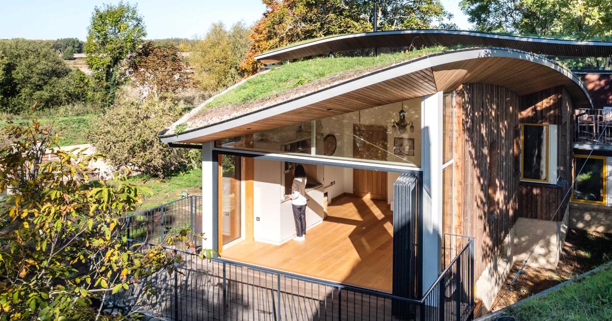 Curved Green Roofs Cover This Creekside Cabin