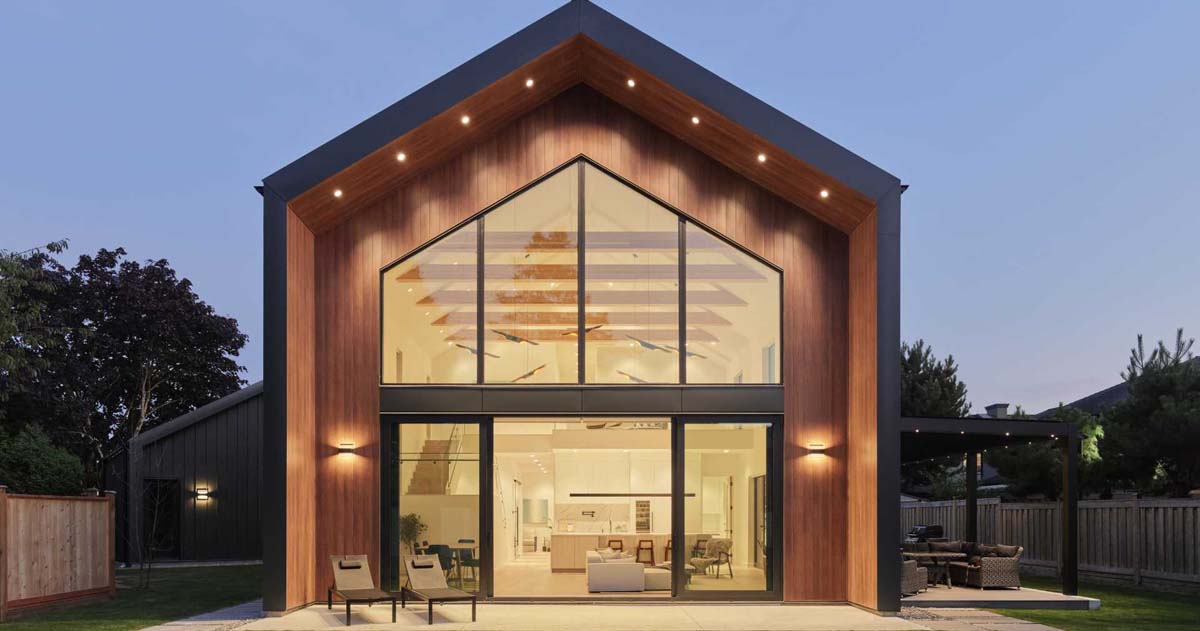 A Vaulted Ceiling Is A Dramatic Feature Inside This Modern Barn House