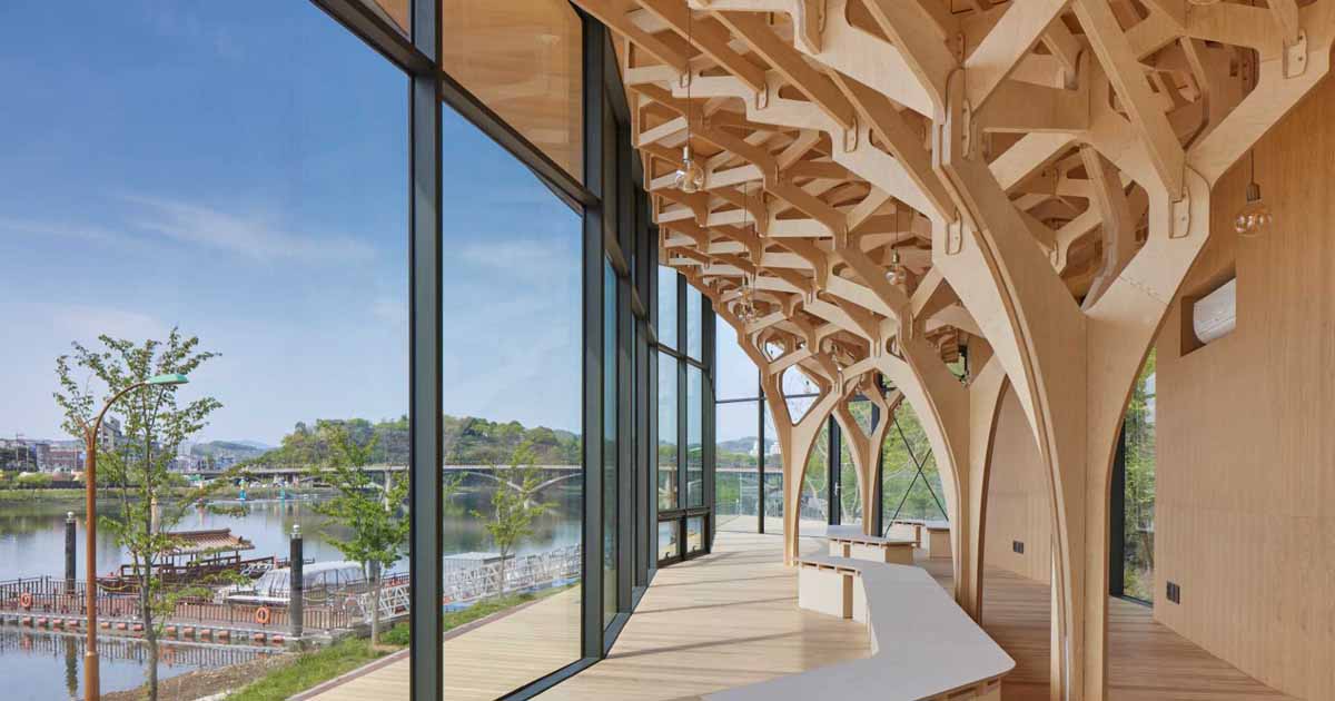 Tree-like Columns Show The Craftsmanship Inside This Riverside Pavilion